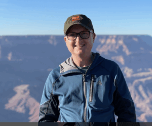 Tony Roche, pictured in nature in front mountains