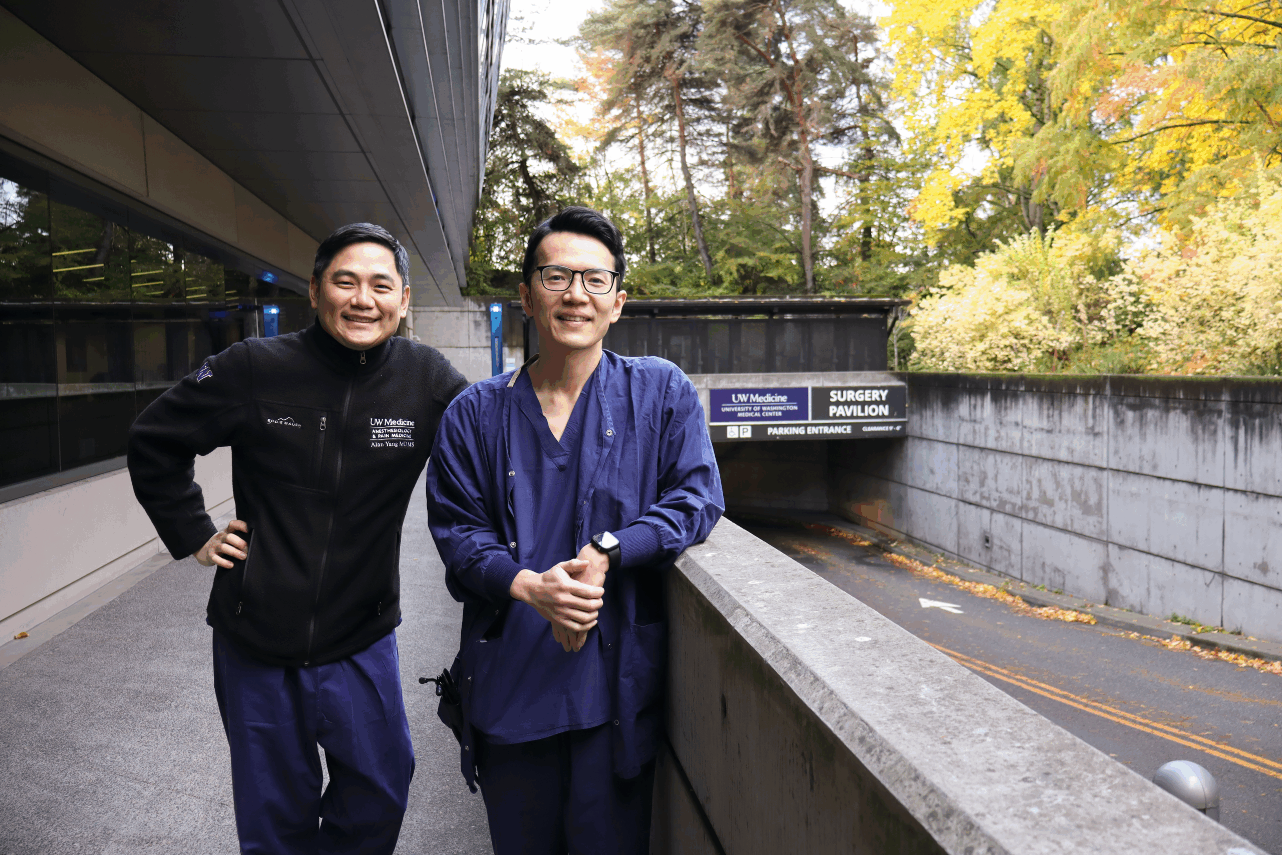 Drs. Alan Yang and Akira Mukai standing together outside of the UW Medicine surgery pavillion.