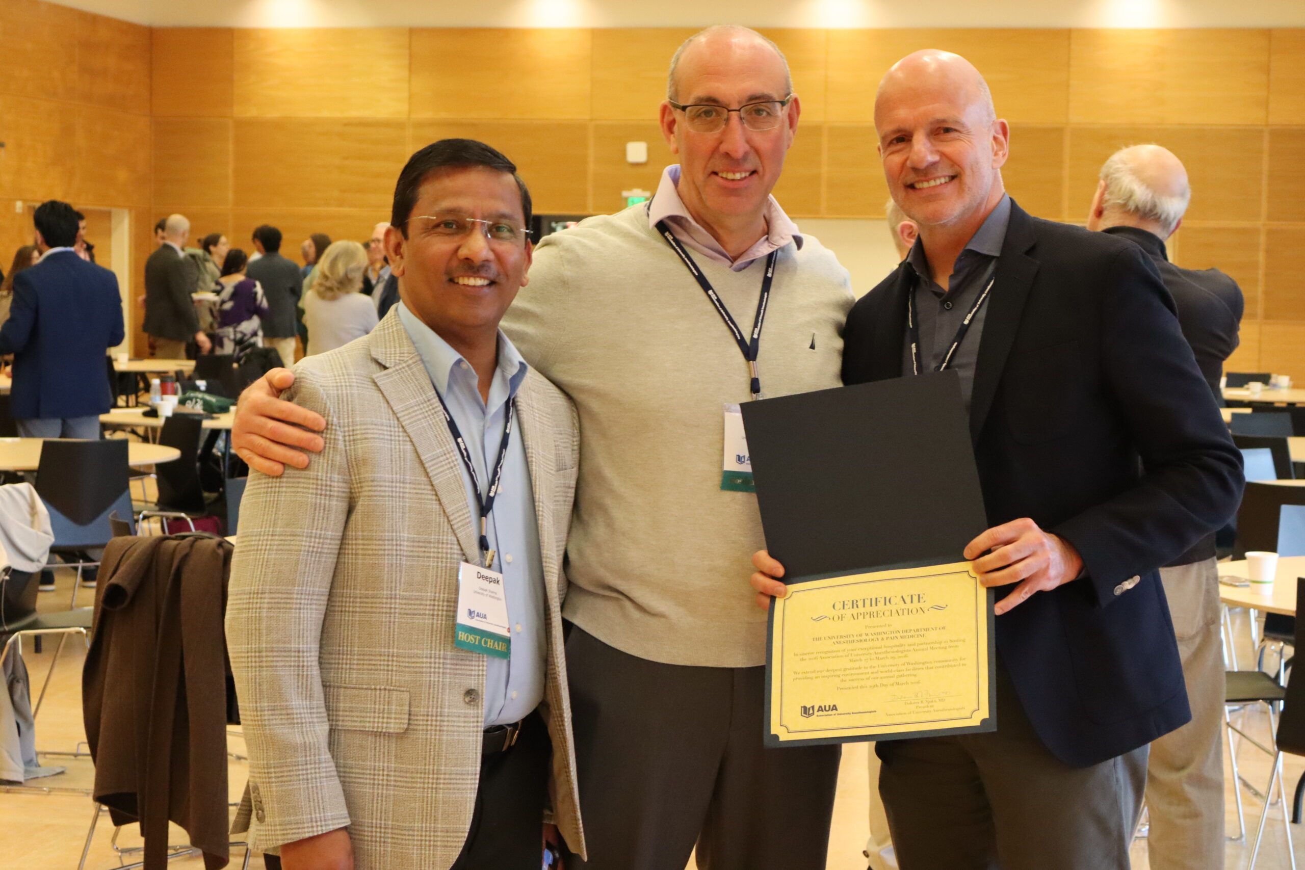 UW Anesthesiology & Pain Medicine faculty Deepak Sharma, Itay Bentov and G. Burkhard Mackensen at the AUA Meeting. Dr. Mackensen holds a certificate acknowledging our host status.