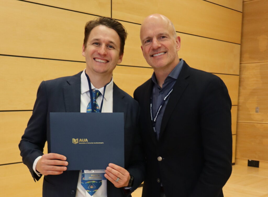 Bonica Scholar Ian Jones celebrates his award with Department Chair G. Burkhard Mackensen at the AUA Annual Meeting