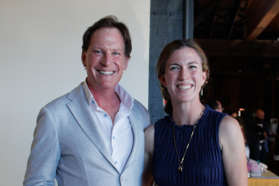 Drs. Matthew Hallman and Casey Quinlan standing together at the 2026 Residency Graduation event.