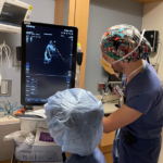 Two clinicians view a point of care ultrasound image
